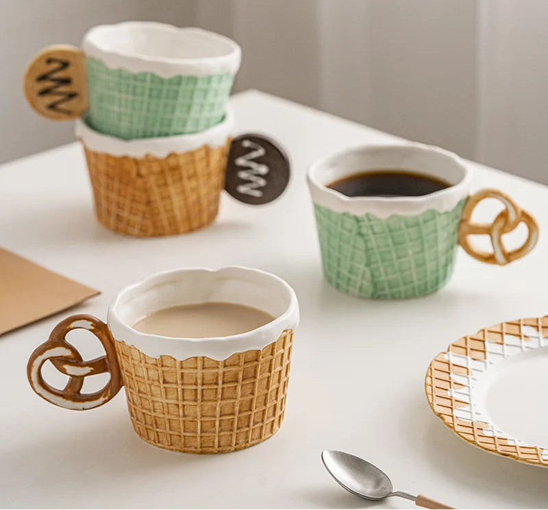 Three ceramic mugs with waffle design handles on a white surface