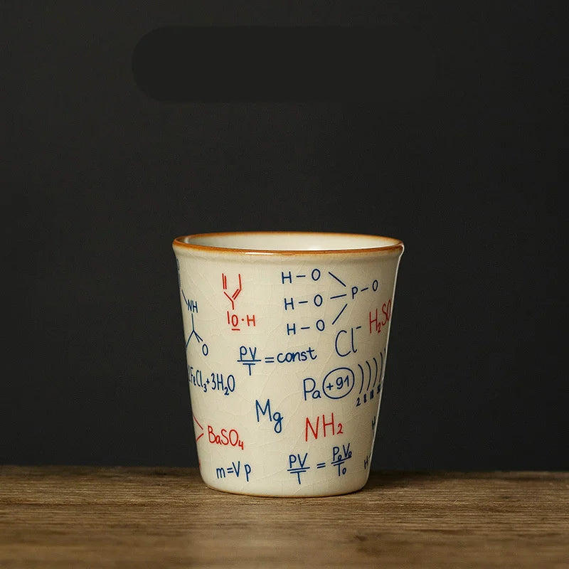 Ceramic cup with chemical formulas on a wooden surface and dark background