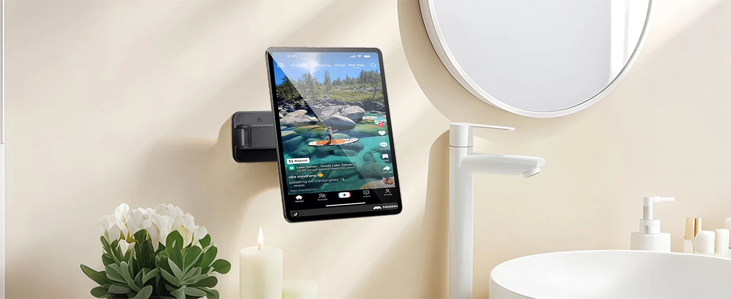 Smart mirror with a phone mounted on it in a bathroom setting