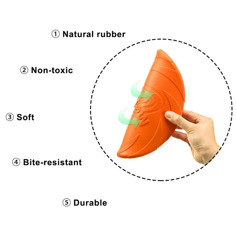 Orange dog toy shaped like a carrot held by a hand, with text indicating its properties on a white background.