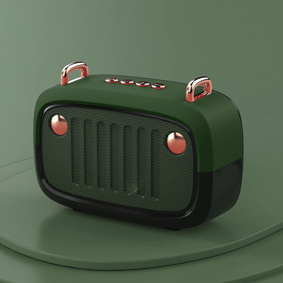 Green portable speaker with rose gold accents on a green background