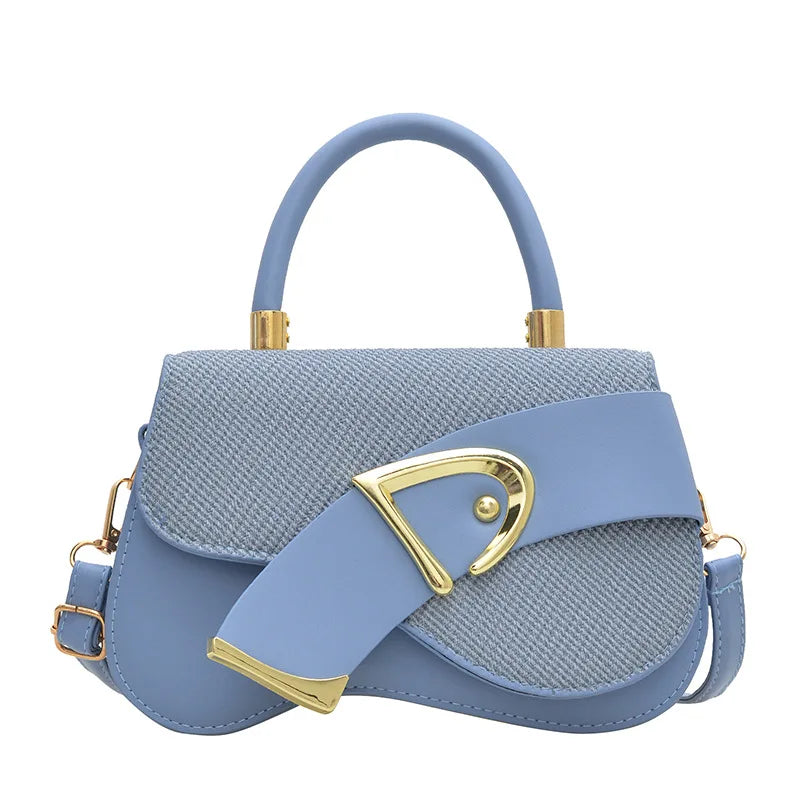 Blue handbag with gold accents on a white background