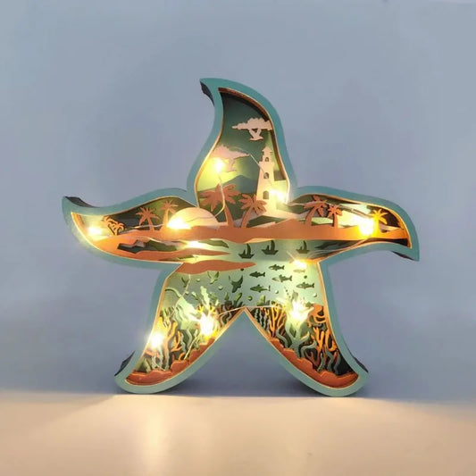 Star-shaped decorative light with ocean-themed design on a plain background