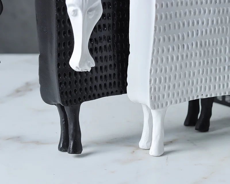 Close up of Abstract armoured horse sculpture in black and white resin with textured decorative armour, modern contemporary ornament for home decor.