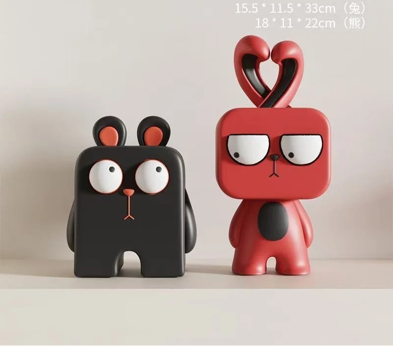 Two cartoon-style figurines, one black and one red, on a light background with text indicating dimensions.