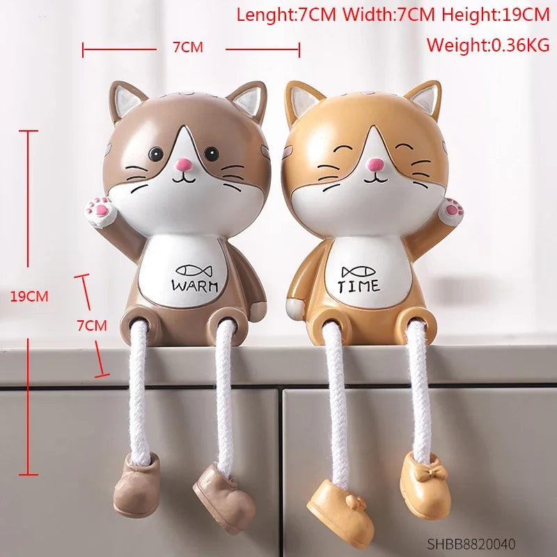 Two cartoon cat-shaped pull toys with measurement details on a white background