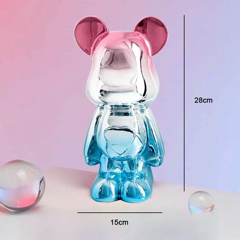 Translucent blue and pink bear-shaped object with measurements on a gradient background