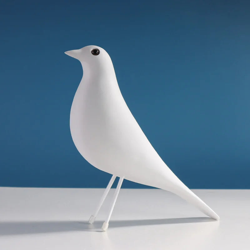 Matte resin bird sculpture in Nordic minimalist style displayed as a modern decorative ornament for living rooms, bedrooms and offices.