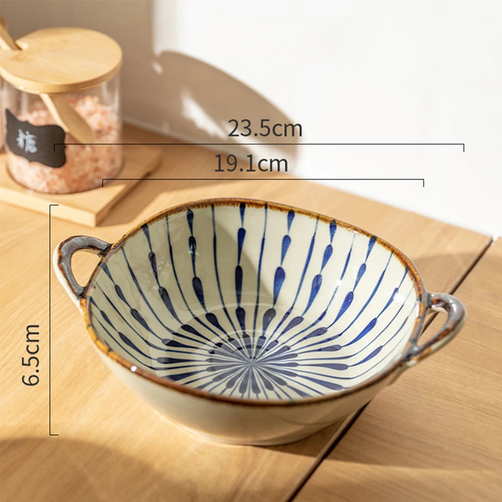 Ceramic bowl with blue patterns on a wooden surface, showing measurements.
