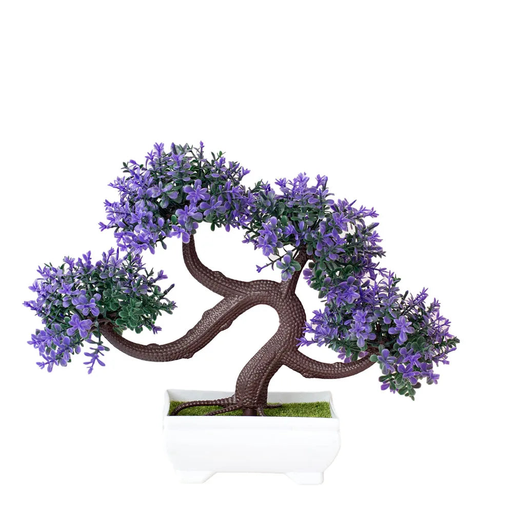 Artificial bonsai tree with purple flowers in a white pot on a white background