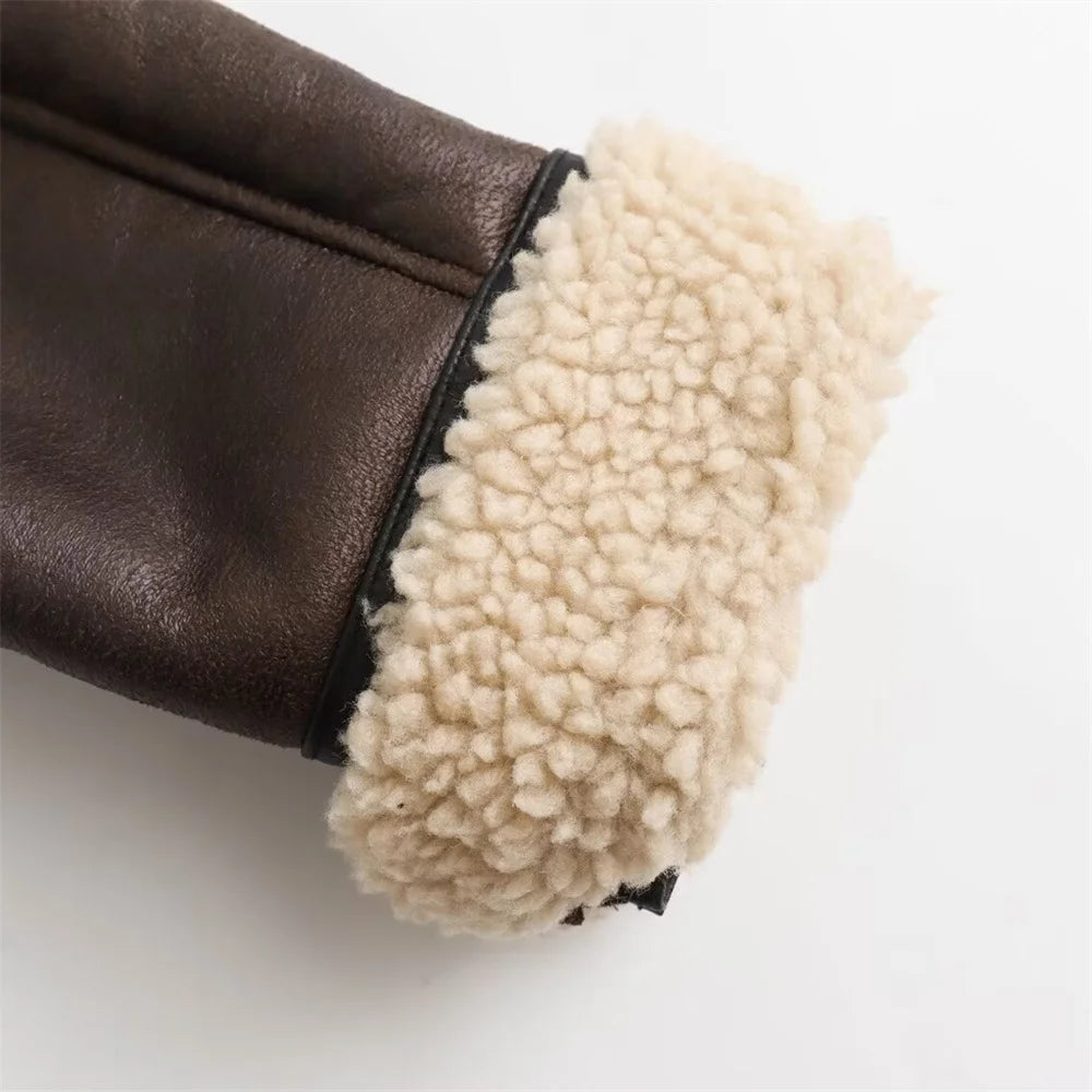 close up of the sleeve of a brown aviator jacket