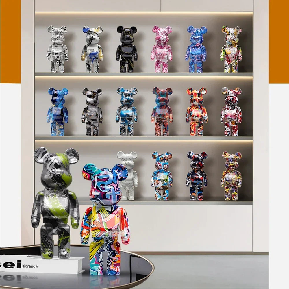 Collection of colorful bear figurines on a shelf with a brand name visible.