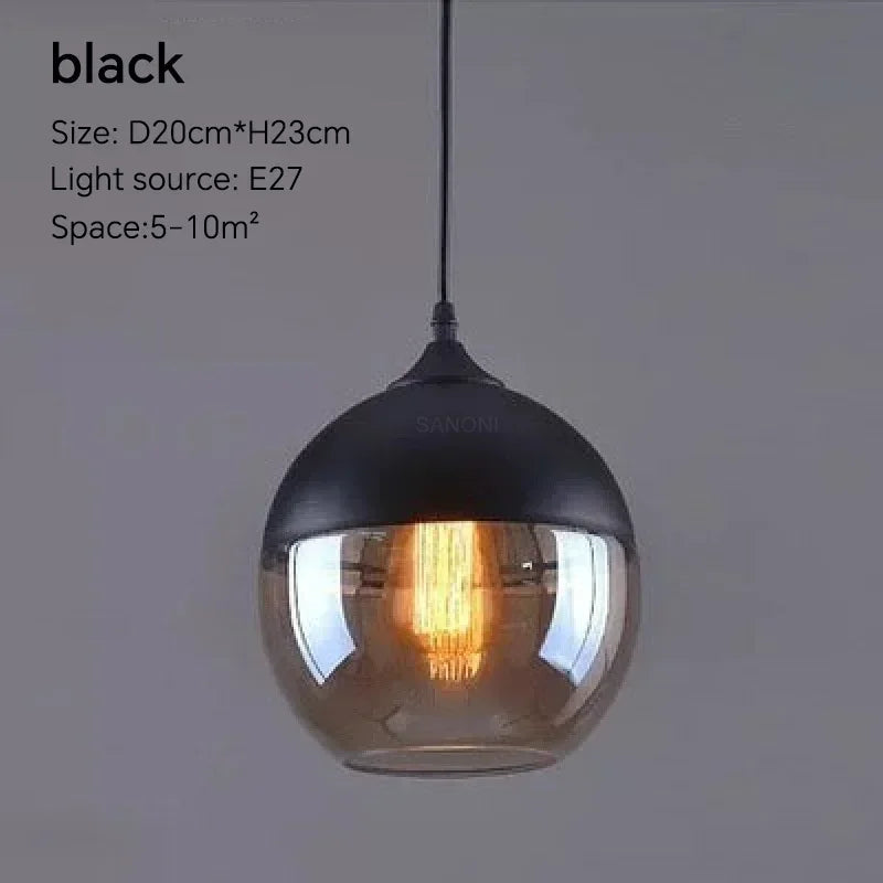 Black pendant light with glass shade on a gray background