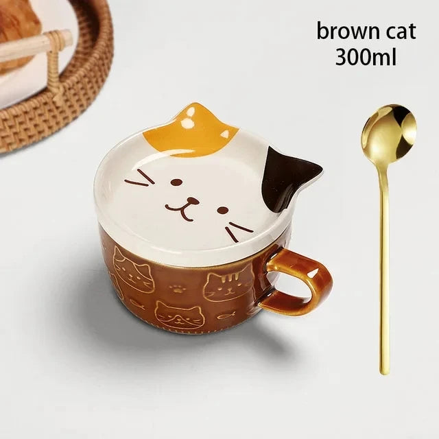 Cat-shaped mug with a gold spoon on a white background