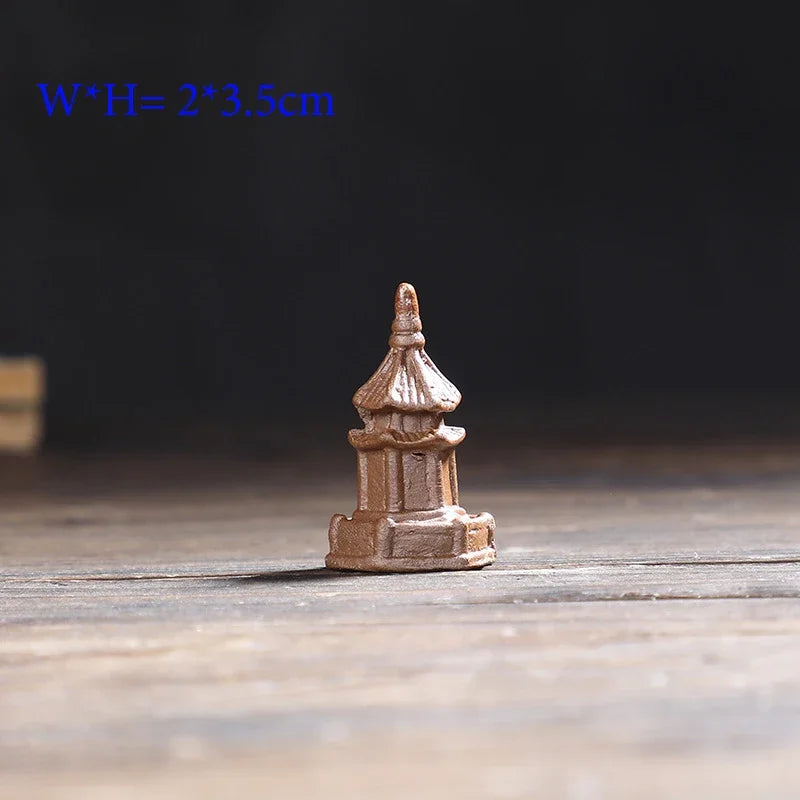 Small pagoda model on a wooden surface with a dark background