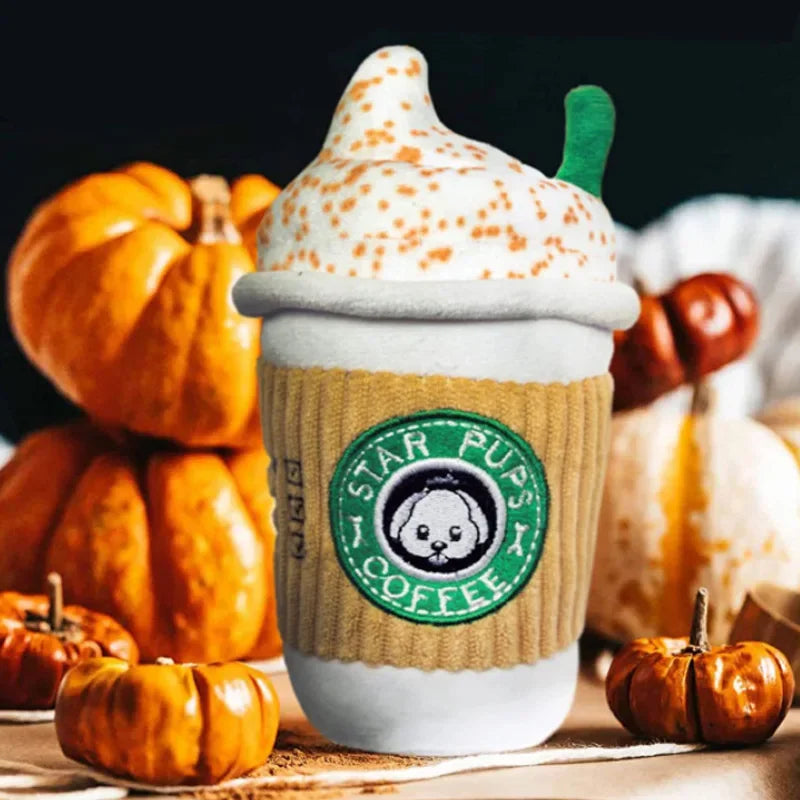 Starbucks-themed cup with pumpkins on a dark background