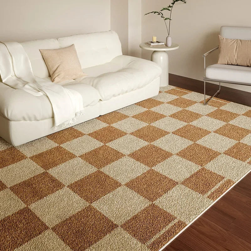 Living room with a checkered brown and beige rug, white sofa, and side table.