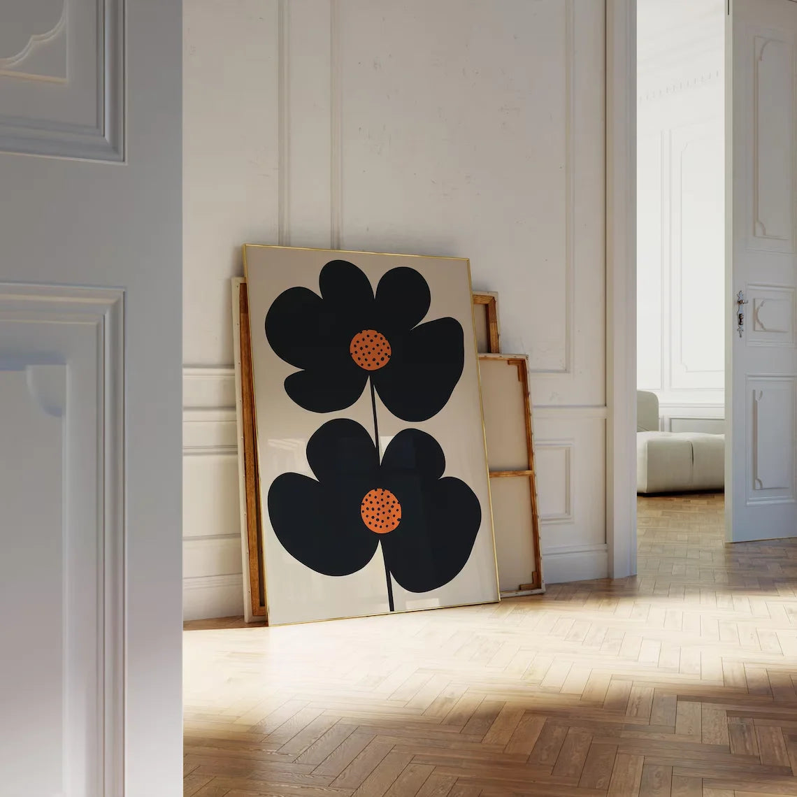 Decorative wall art with black flowers on a white background in a room.