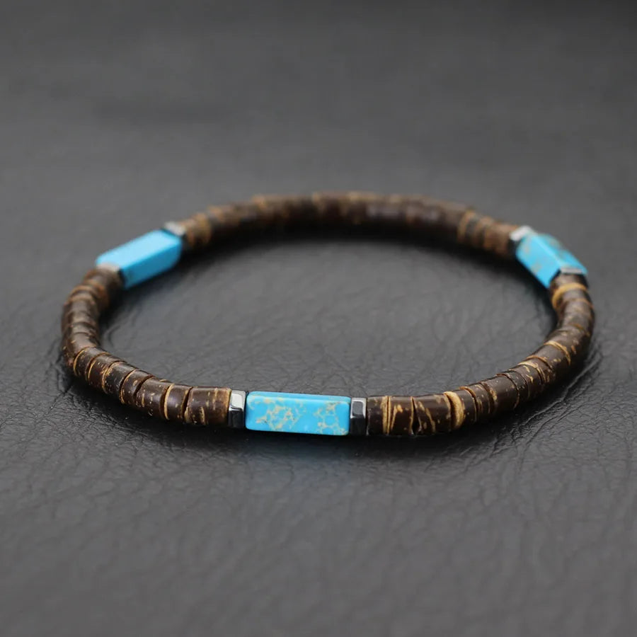 Bracelet with blue beads on a dark textured background