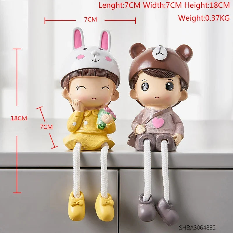Two cartoon character door stoppers with measurement details on a white background