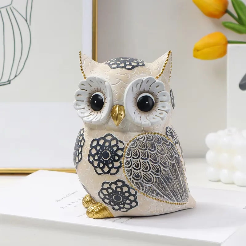 Decorative owl figurine with intricate patterns on a white surface