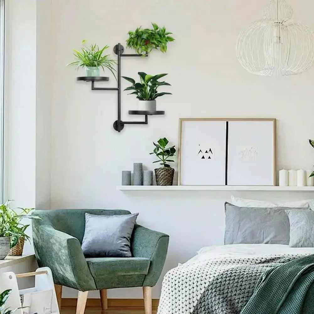 black rotating wall plant shelf with three tiers holding indoor potted plants
