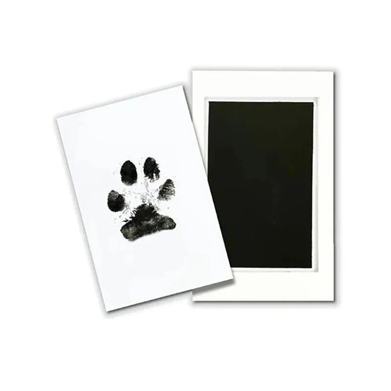 Black paw print on a white card with a black frame on a white background