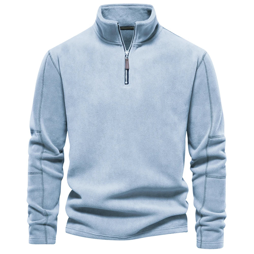 Light blue pullover with a quarter zip on a white background