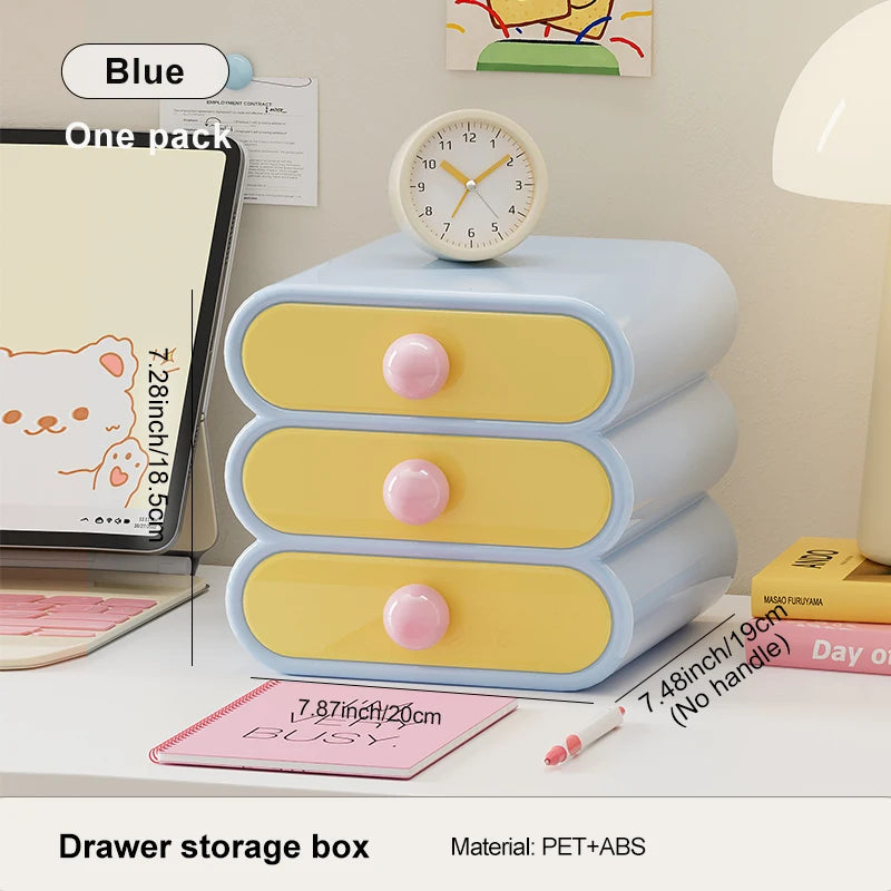 Pastel-colored drawer storage box with pink knobs on a desk, featuring text and measurements.