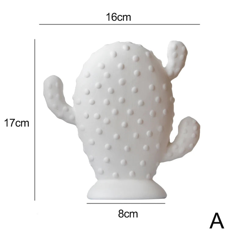 A white cactus-shaped decorative object with dimension labels showing 16 cm width, 17 cm height, and 8 cm base, on a light gray background.