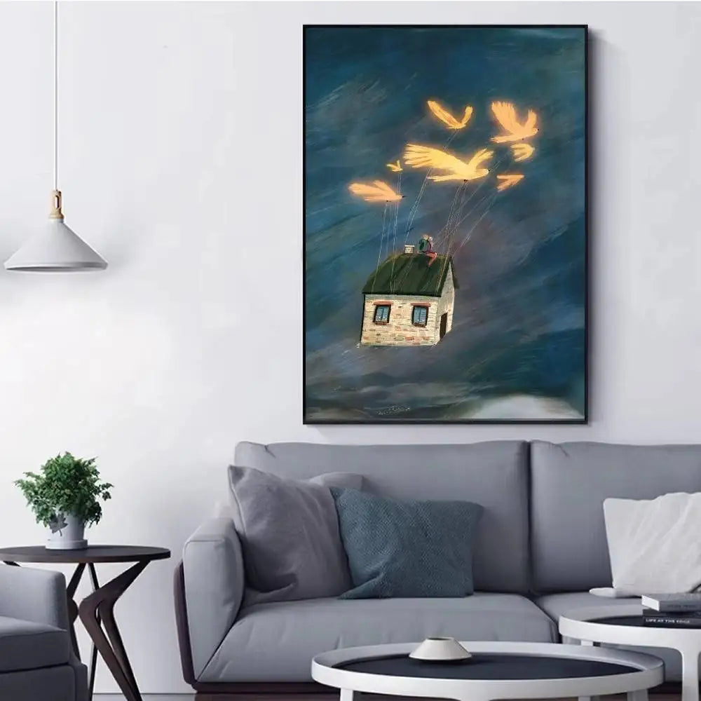 Framed artwork of a house floating in the sky above a living room with a gray sofa.