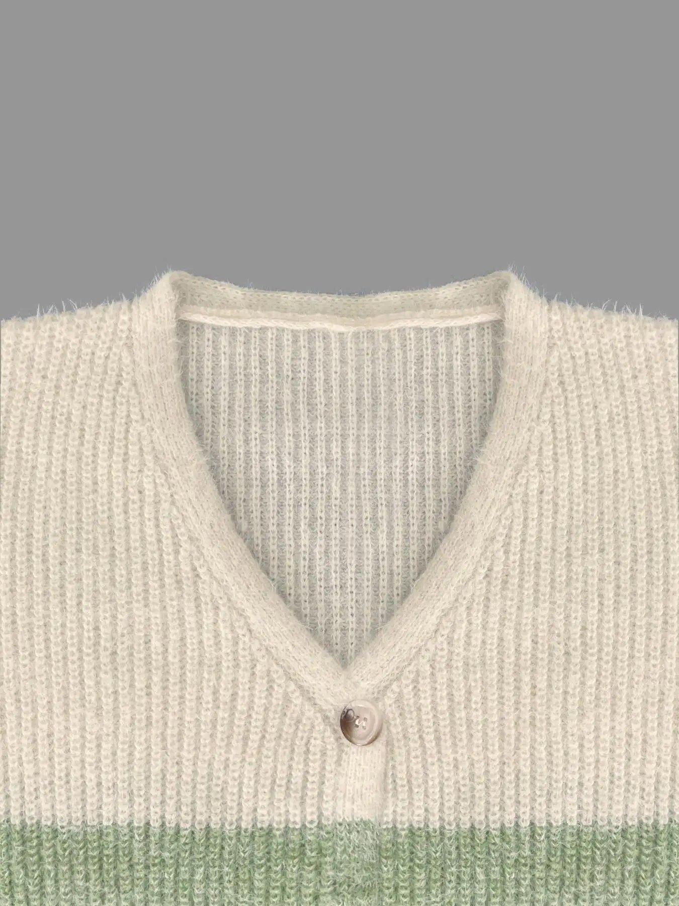 Close up of a striped sweater with green and gray stripes collar line