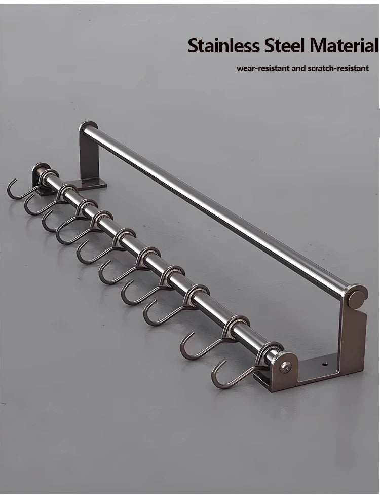 Stainless steel rack with hooks on a gray background