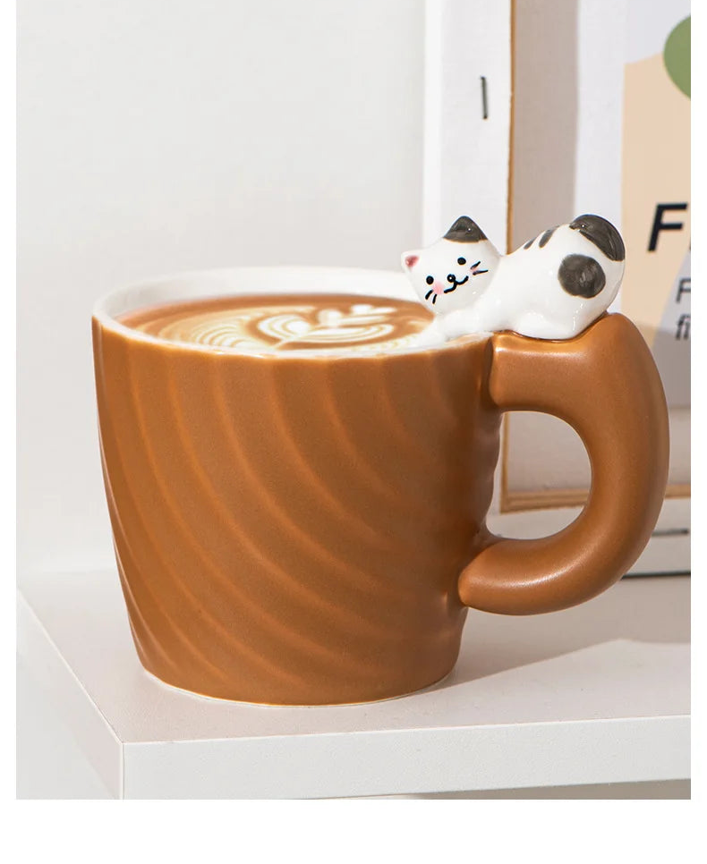 Ceramic mug with a cat-shaped handle on a white background