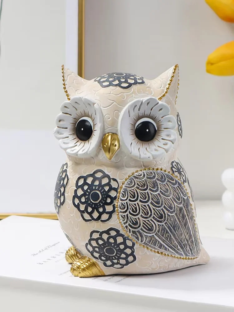 Decorative owl pillow with intricate patterns on a white surface