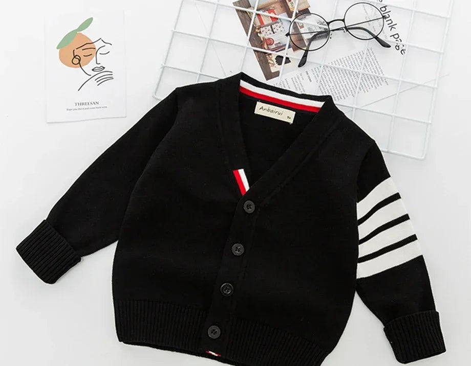 Black cardigan with striped sleeves on a white background