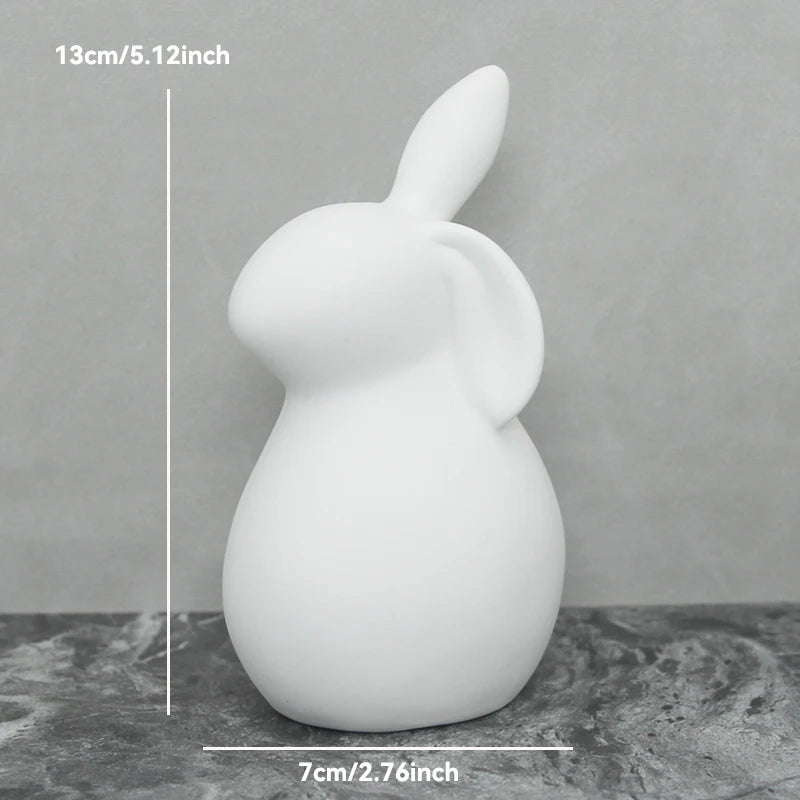White rabbit-shaped object on a gray surface with measurements indicated.