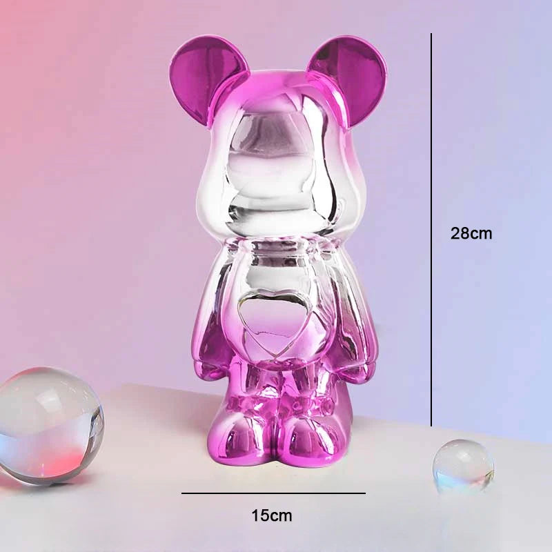 Clear and purple transparent bear-shaped object with measurements on a light pink background