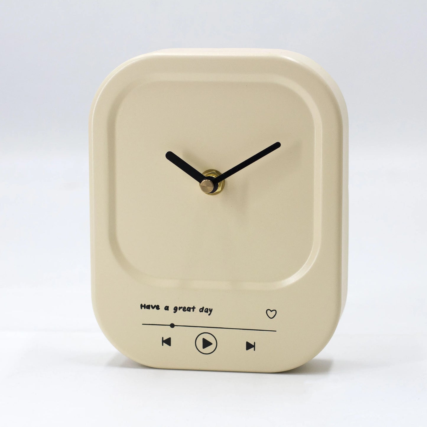 Beige square clock with black text and symbols on a white background
