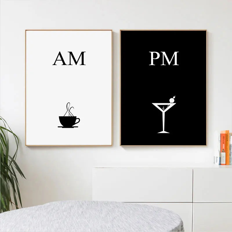 Two framed prints on a wall, one with 'AM' and a coffee cup, the other with 'PM' and a martini glass.