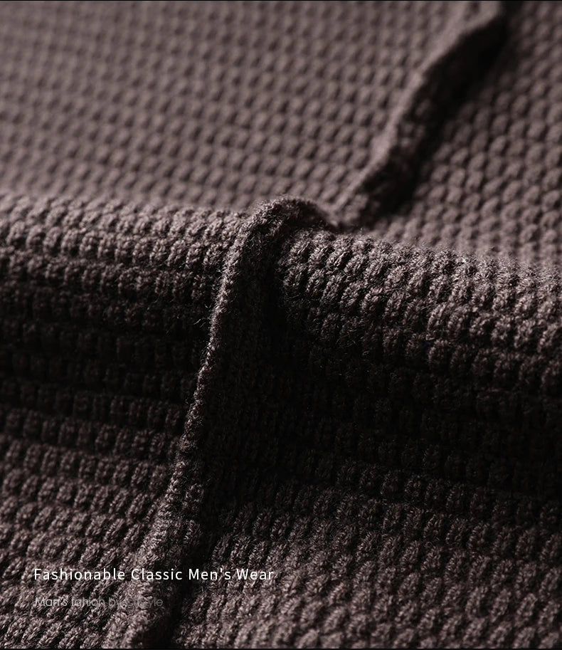 Close-up of textured brown fabric with 'Fashionable Classic Men's Wear' text.