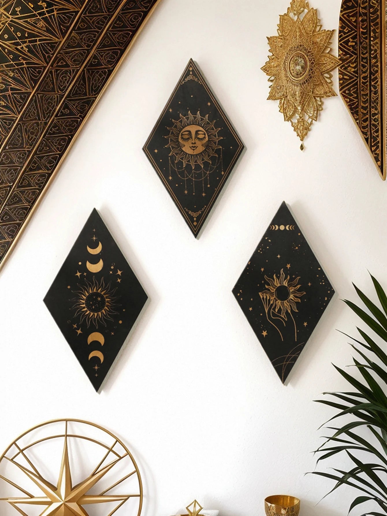 Black wooden celestial wall art panel featuring a golden sun design, perfect for boho and modern home décor.