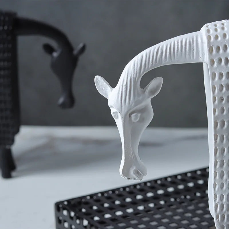 Abstract armoured horse sculpture in black and white resin with textured decorative armour, modern contemporary ornament for home decor.