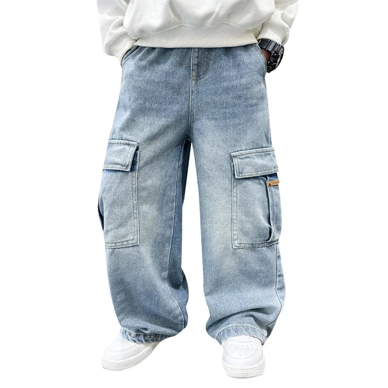 Light blue cargo jeans worn with a white sweatshirt on a white background