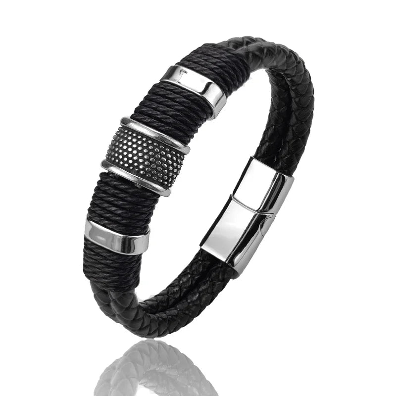 Black braided leather bracelet with silver metal accents on a white background