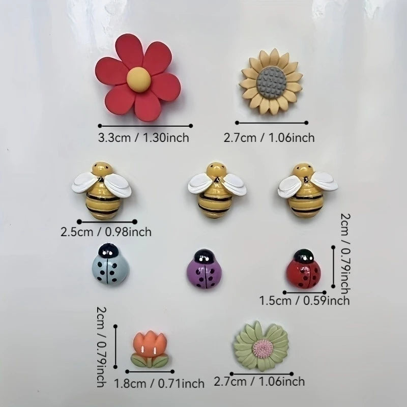 Set of small decorative fridge magnets including a flower, sunflower, bees, ladybugs, and flowers with measurements on a white background.