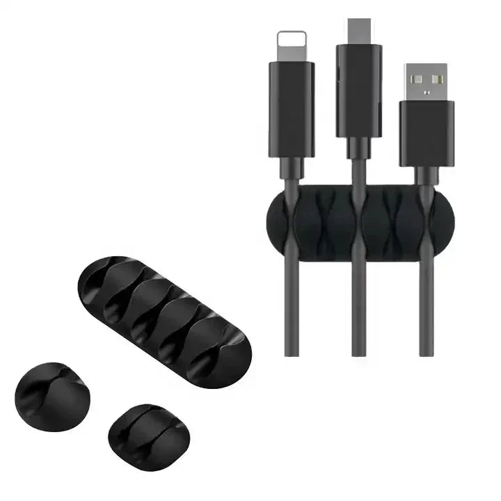 Set of black cable organizers with different connectors on a white background
