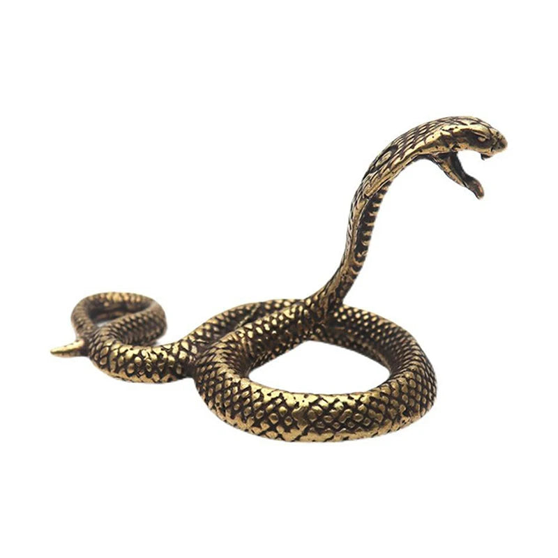 Bronze snake-shaped object on a white background