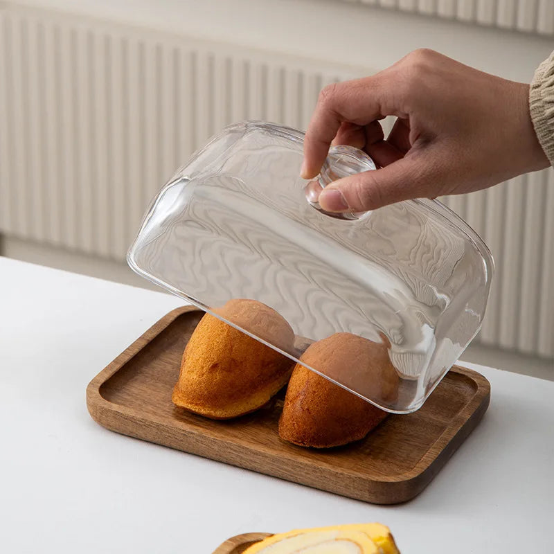 Glass pastry display dome with bamboo serving base