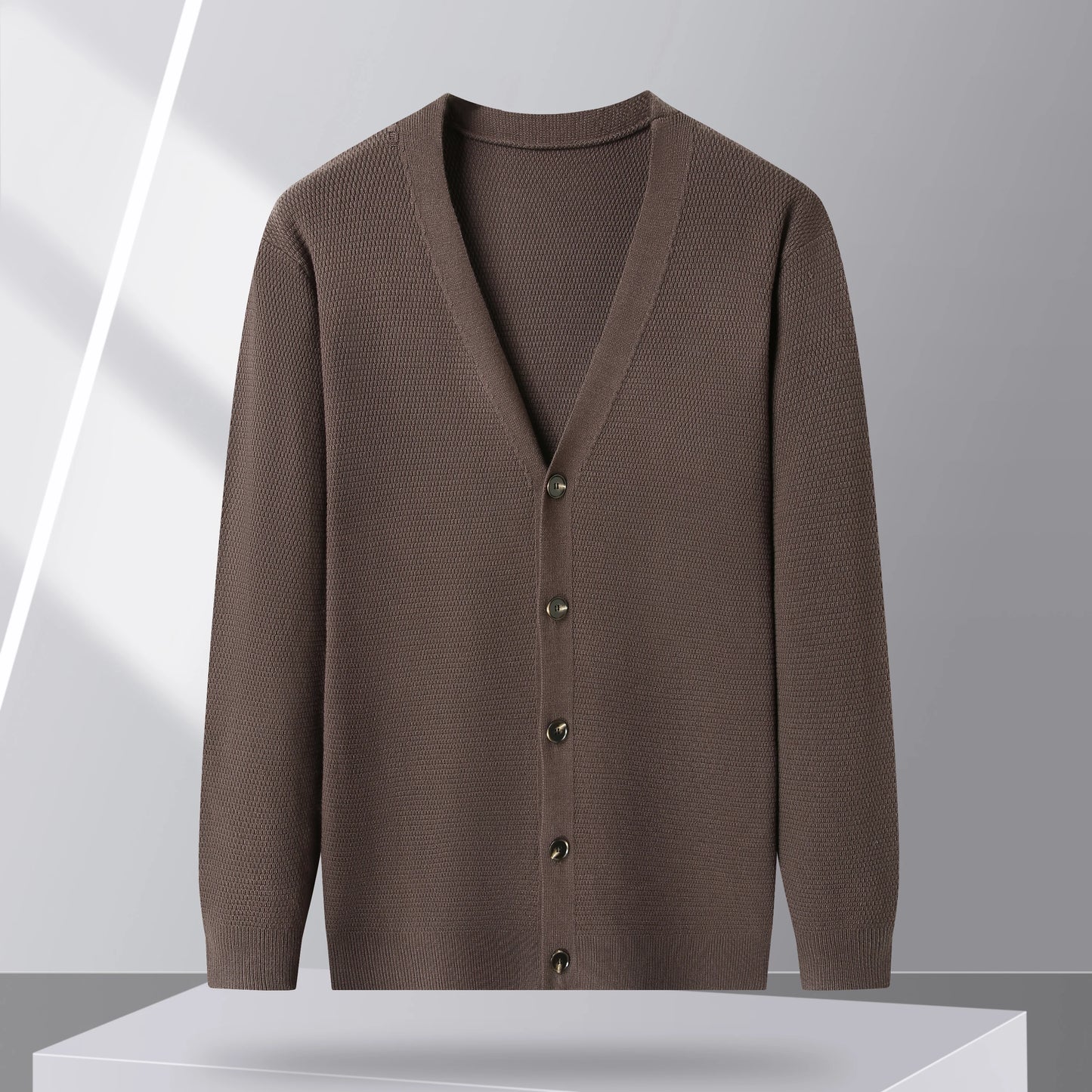 Brown cardigan displayed on a light background